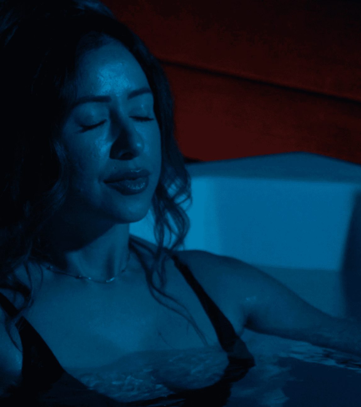 Woman relaxing in a cold plunge