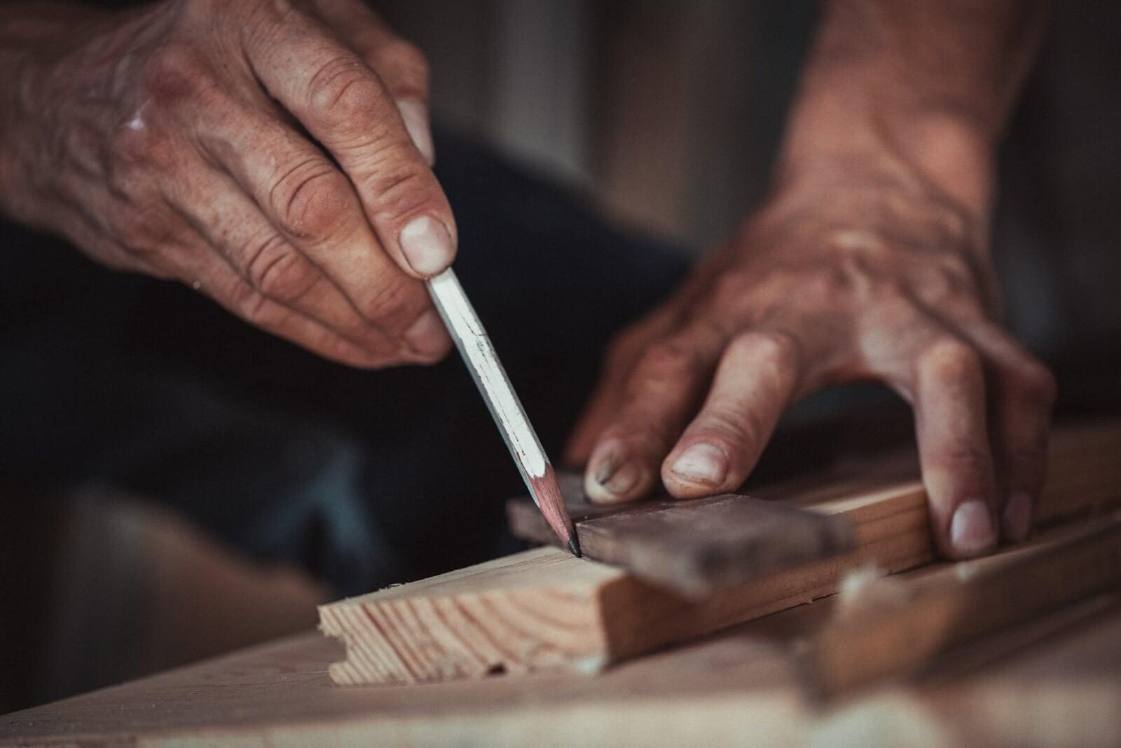 Craftsman marking sauna wood